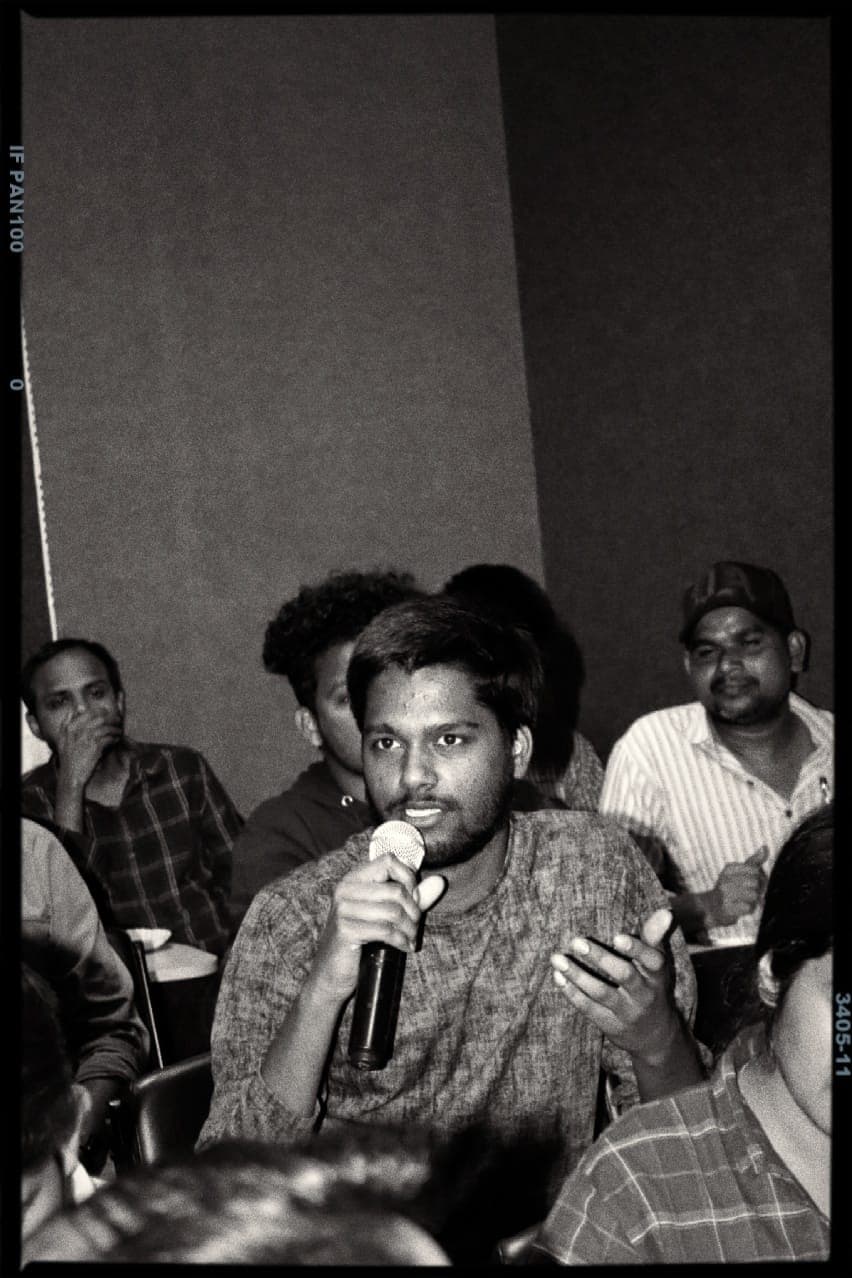 Prayag talking about tranditional gender roles during womens's day celebration at University of Hyderabad.